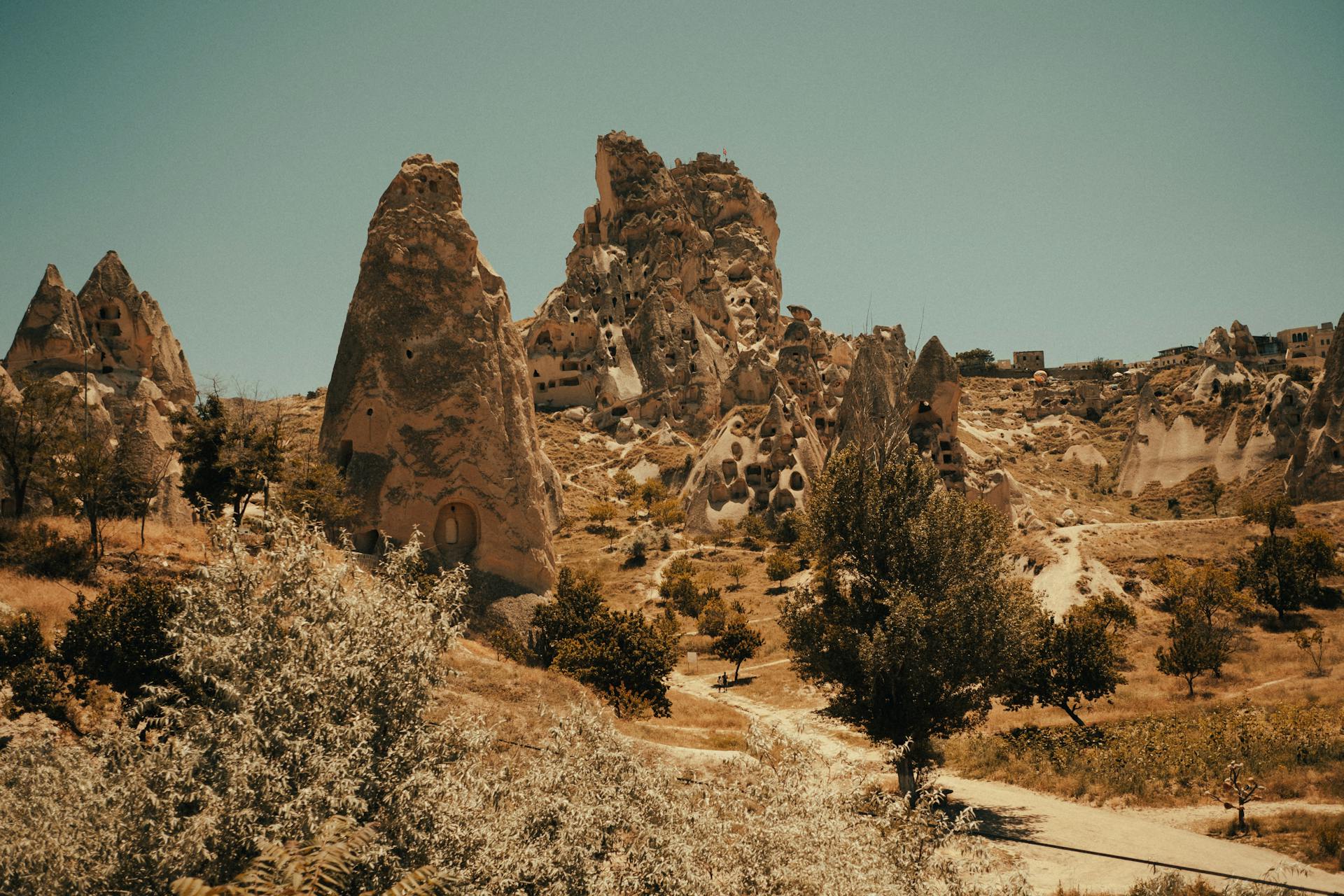 Explore the unique rock formations and ancient citadel structures of Uçhisar Castle in Cappadocia's stunning landscape.