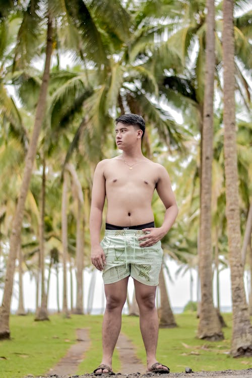 Photograph of a Shirtless Man Looking Away