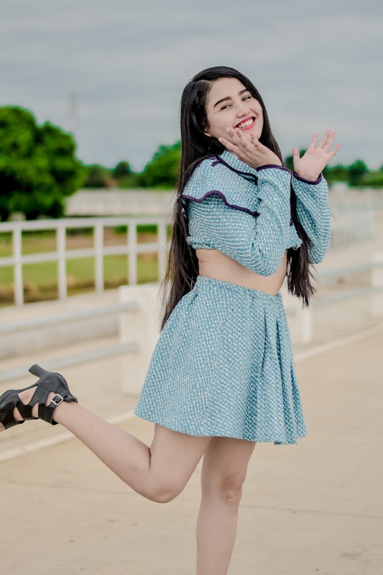 A Happy Woman Wearing A Skirt