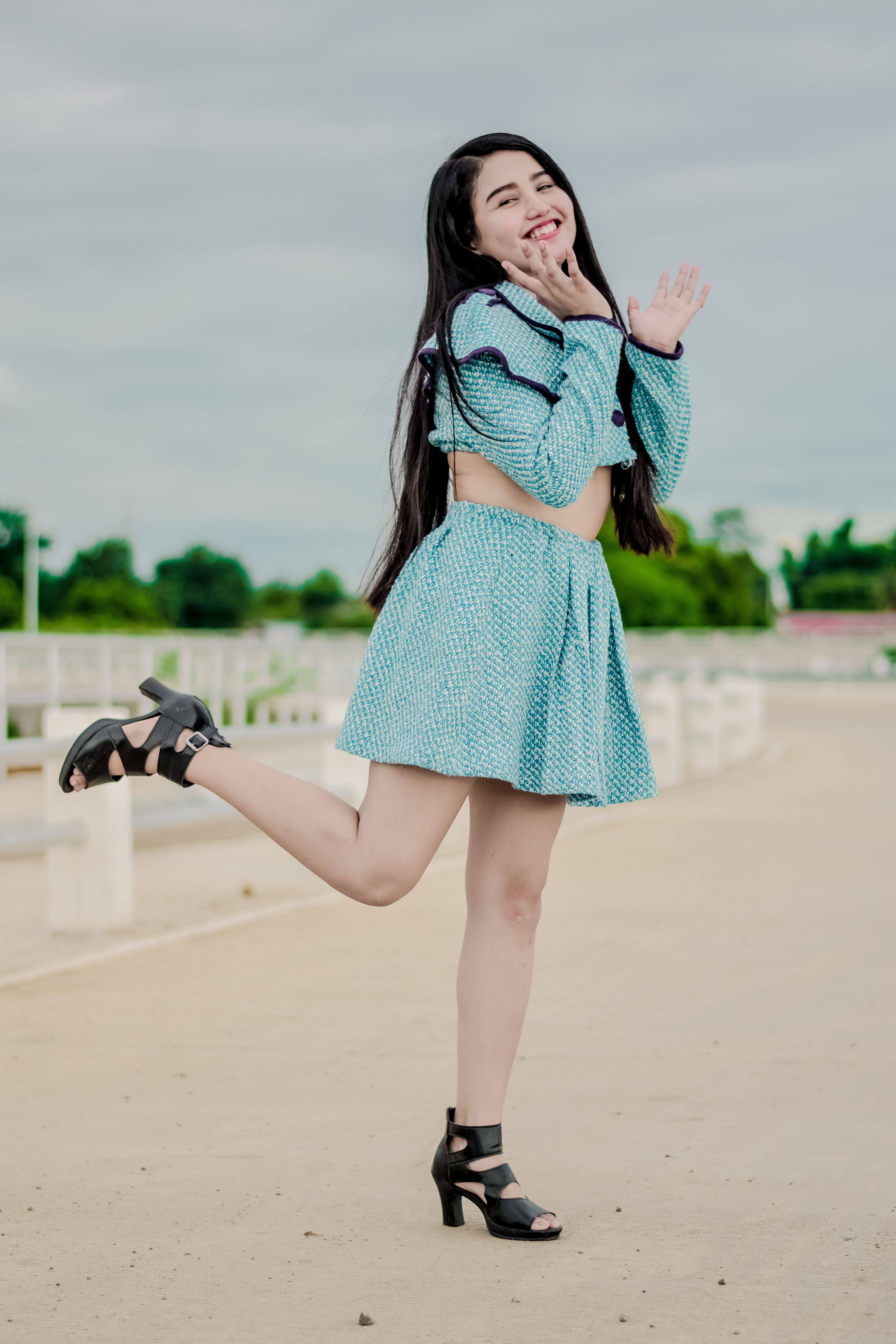 Woman in Blue Dress Posing on One Foot · Free Stock Photo