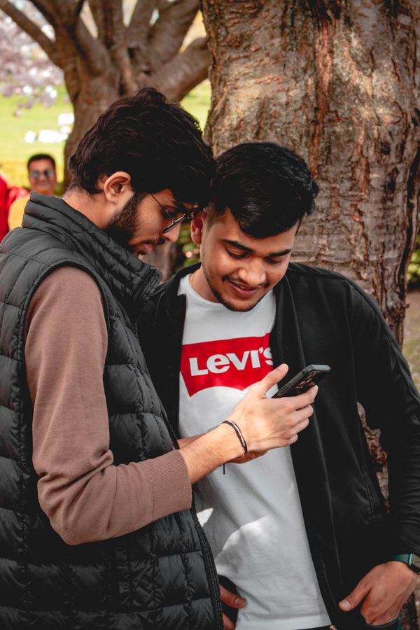 Men looking at smartphone