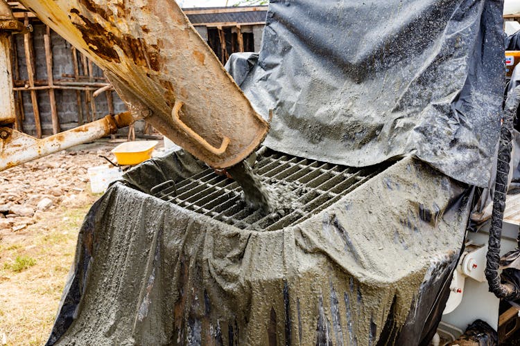 Pouring Concrete At Construction Site