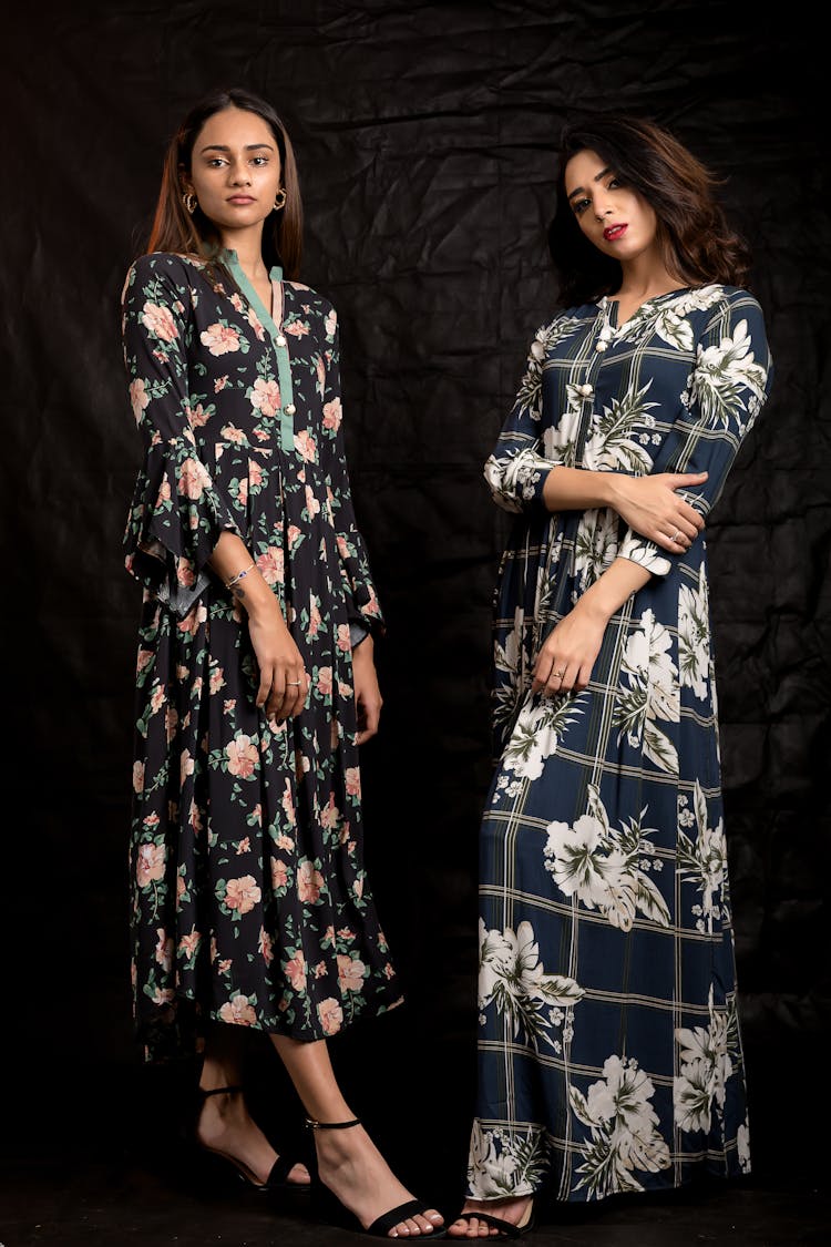 Two Models In Long Dresses