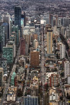 High-rise buildings and busy streets of Vancouver, showcasing modern urban architecture.