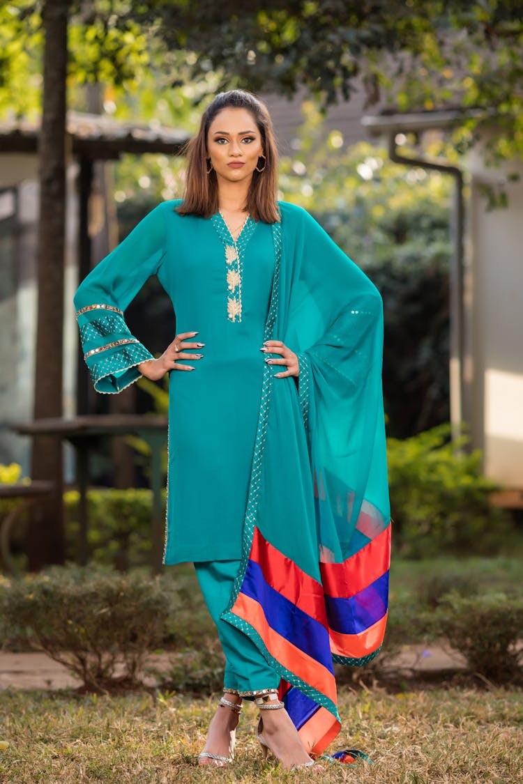 A Woman In Blue Shalwar Kameez Dress