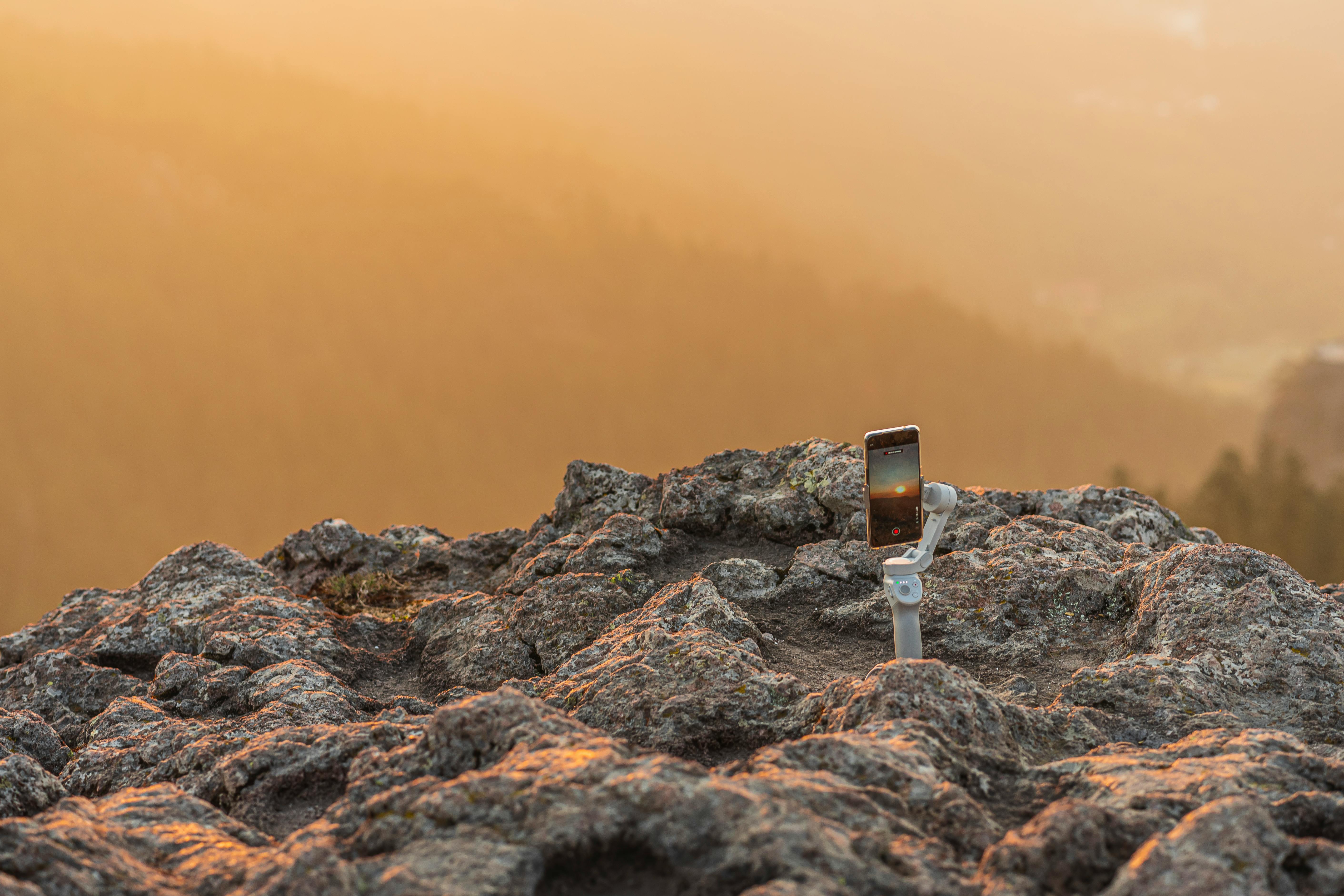 image of a phone on a gimbal capturing sunrise