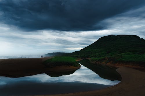 An Estuary under a Gloomy Sky