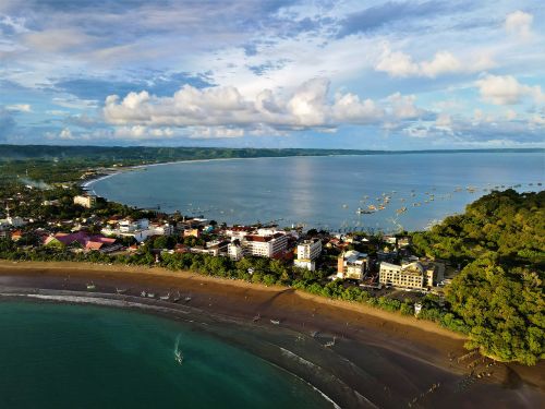 Free Explore the stunning aerial view of Pangandaran Beach and coastal town in Indonesia, showcasing its natural beauty. Stock Photo
