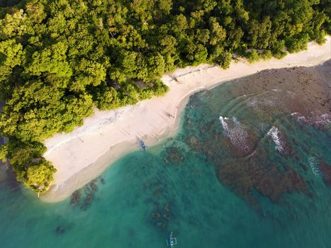 Stunning aerial view of Pangandaran Beach showcasing turquoise waters and lush greenery.