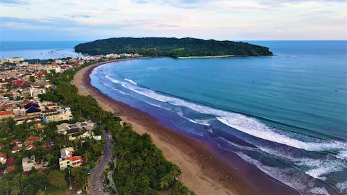 Beautiful View of a Shoreline Near Residential Buildings