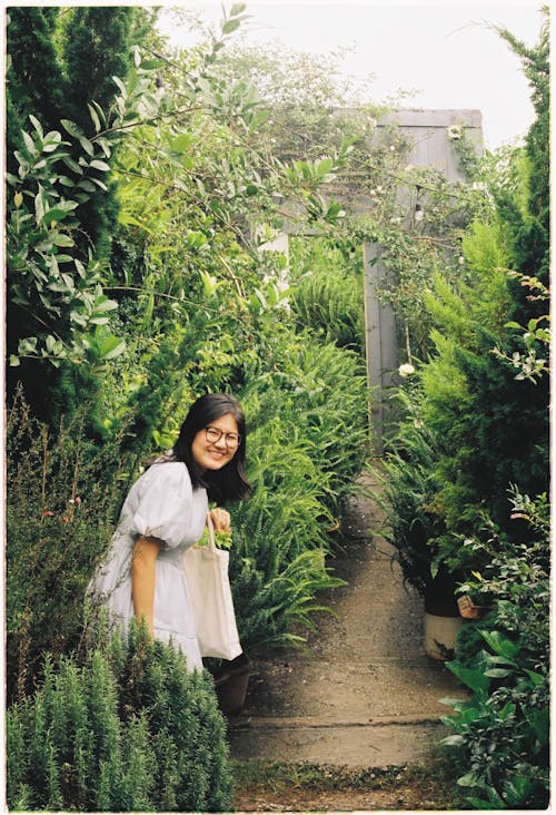 Happy Young Woman in a Garden 