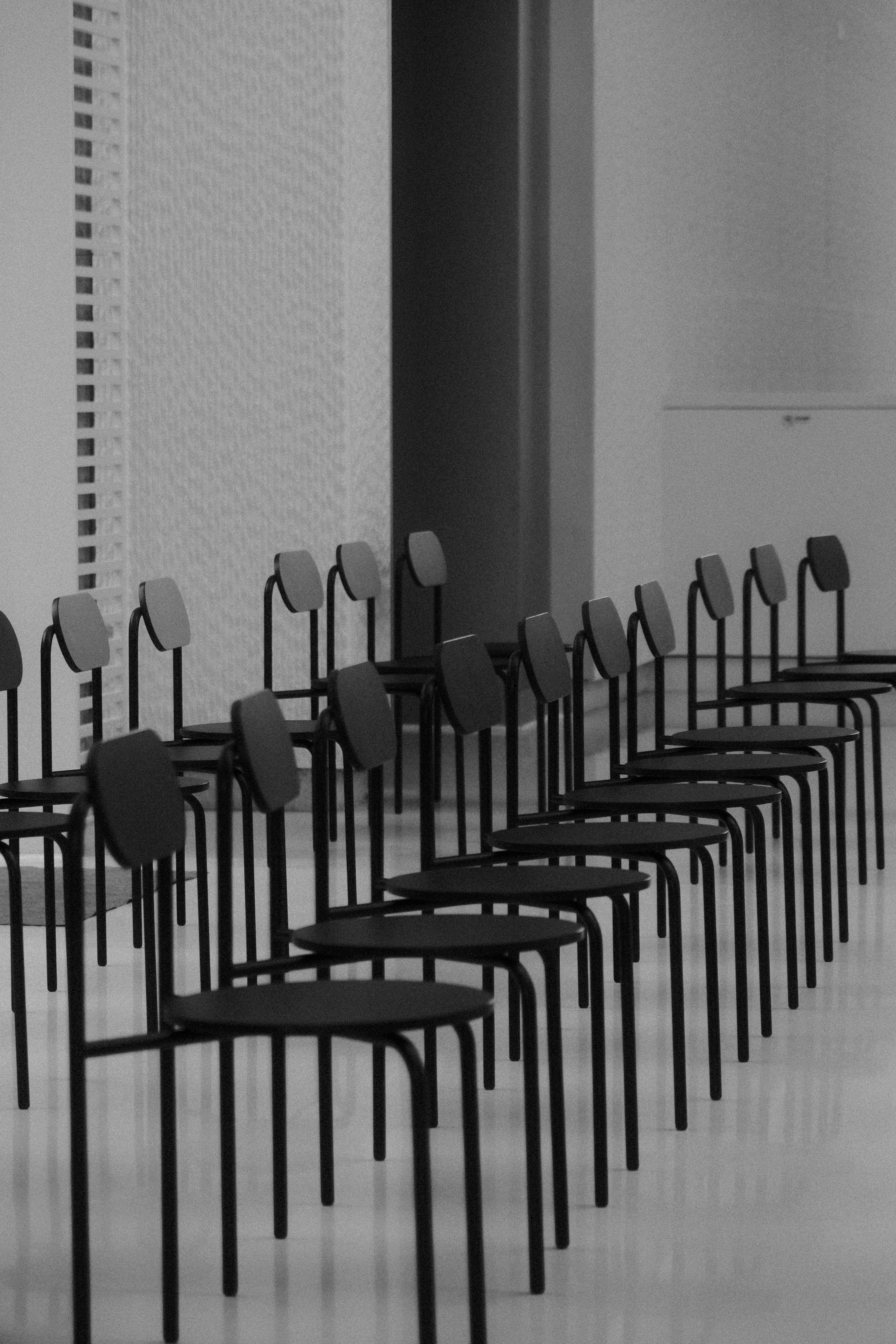 Arranged Black Metal Chairs · Free Stock Photo