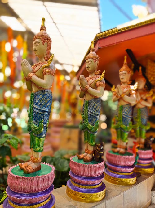 Colorful Praying Buddha Figurines