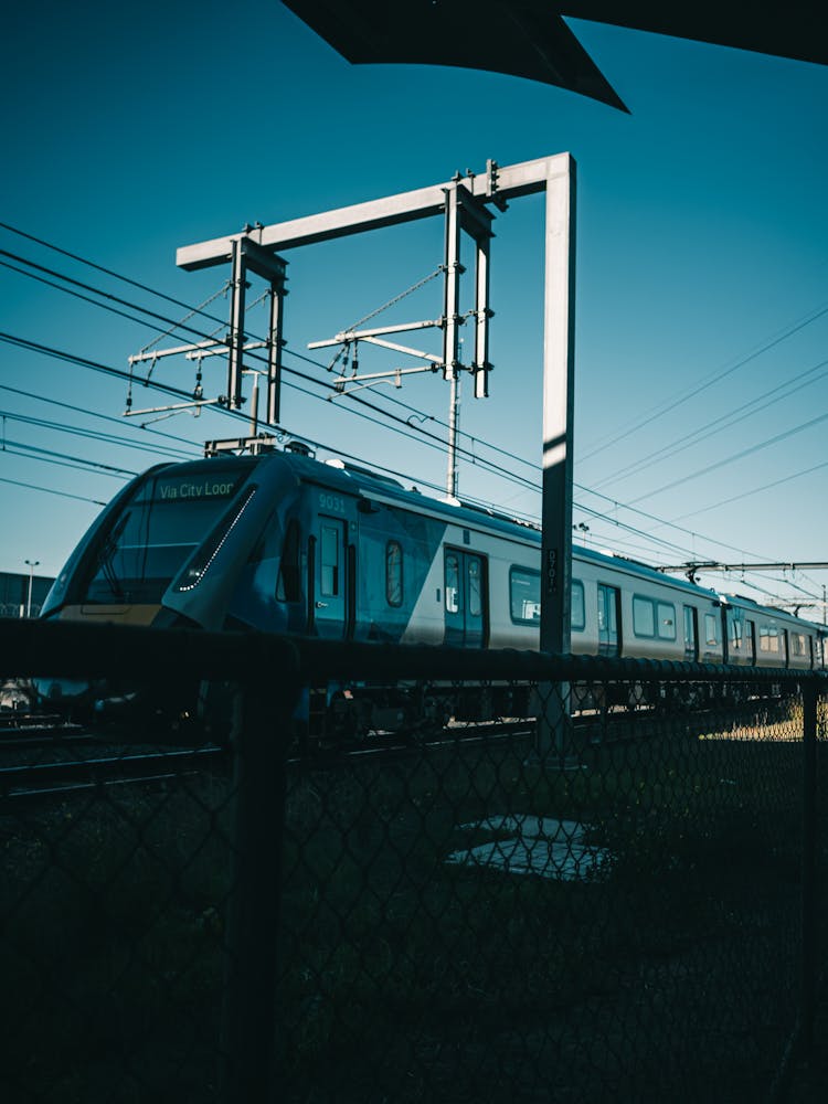 Modern Train On Railroad Tracks