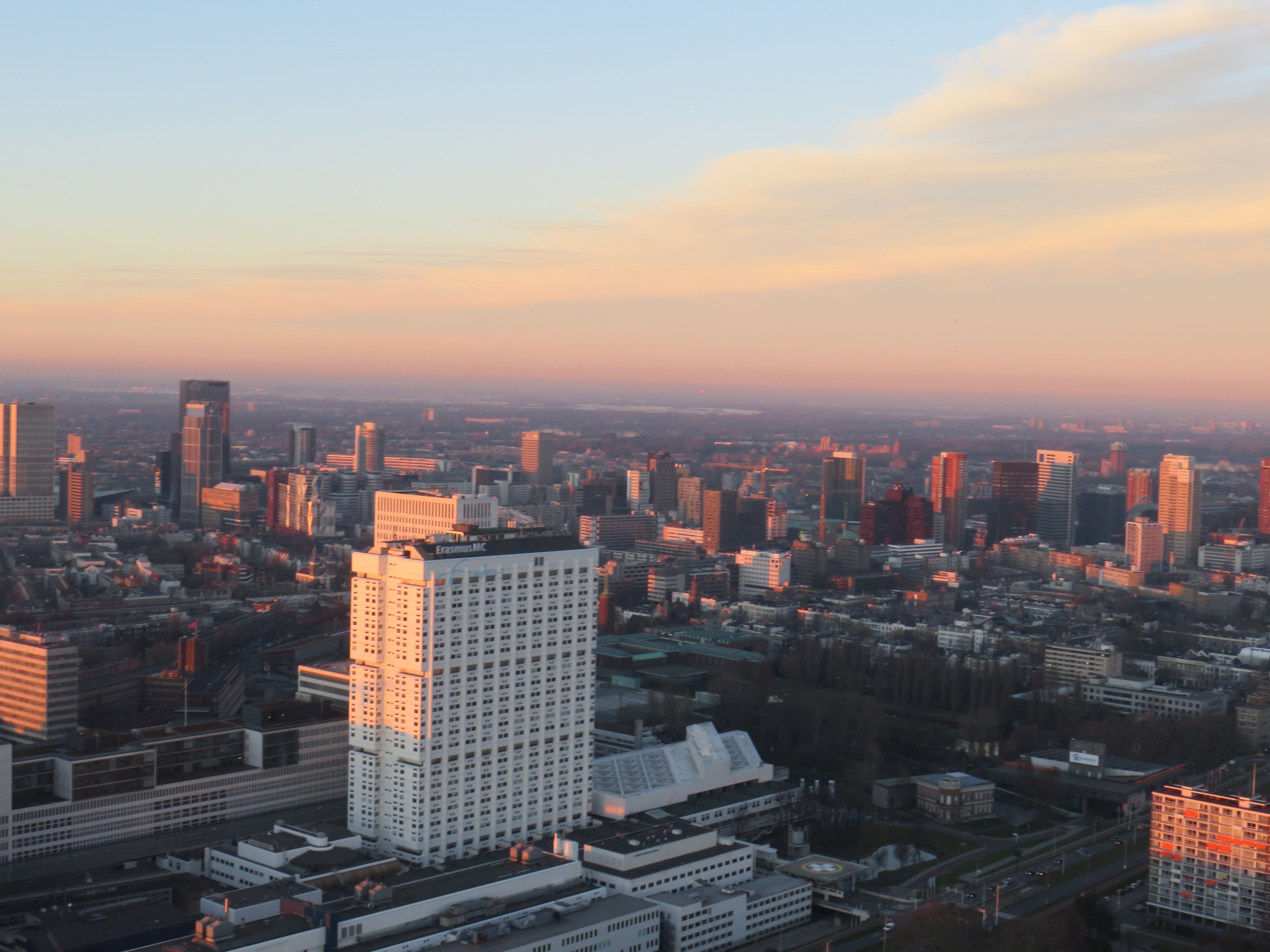 A stunning cityscape showcasing skyscrapers during a vibrant sunset view.
