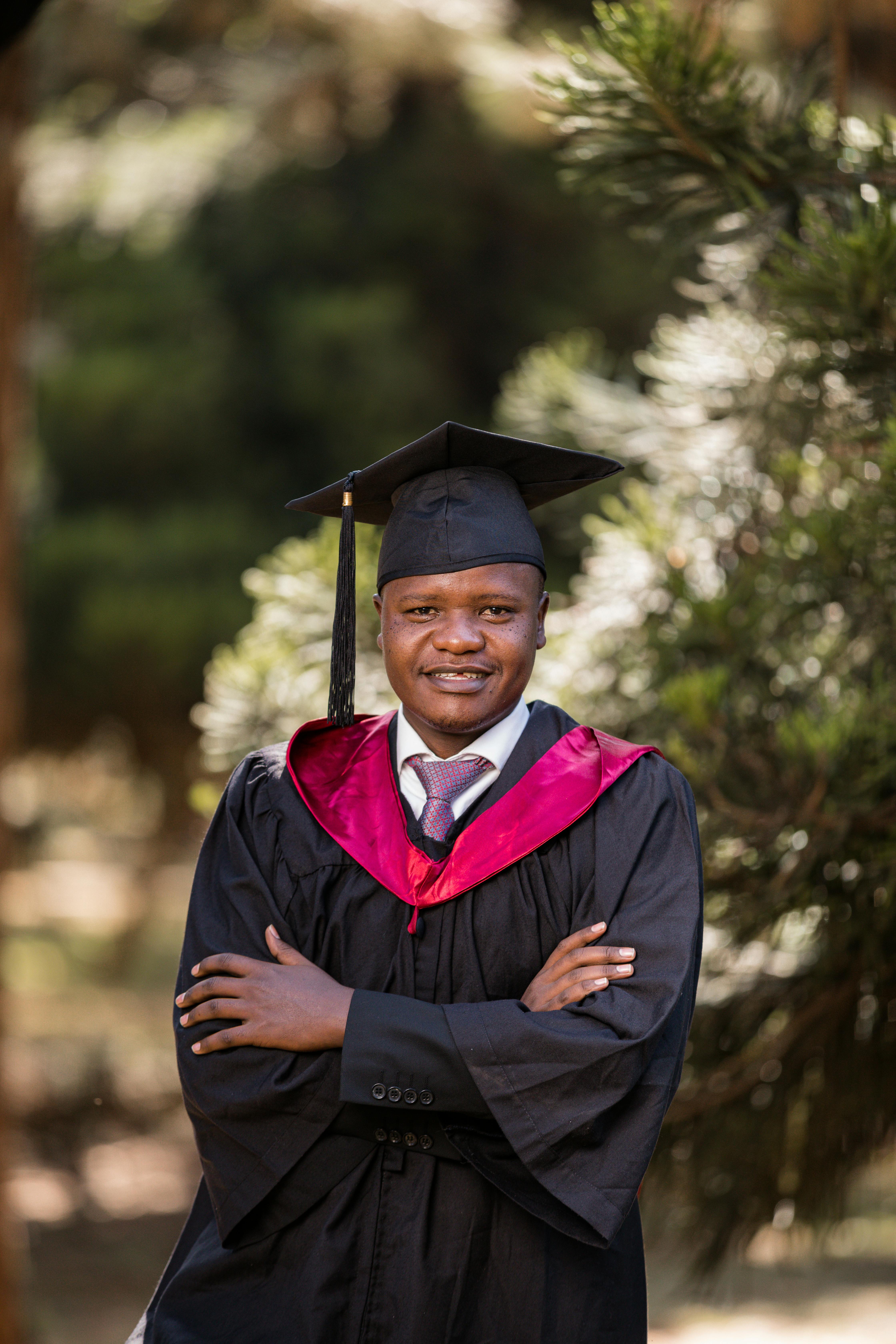 Young Man in a Graduation Gown · Free Stock Photo