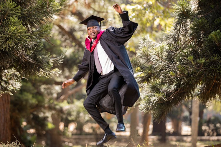 A Graduating Man Jumping In Joy 