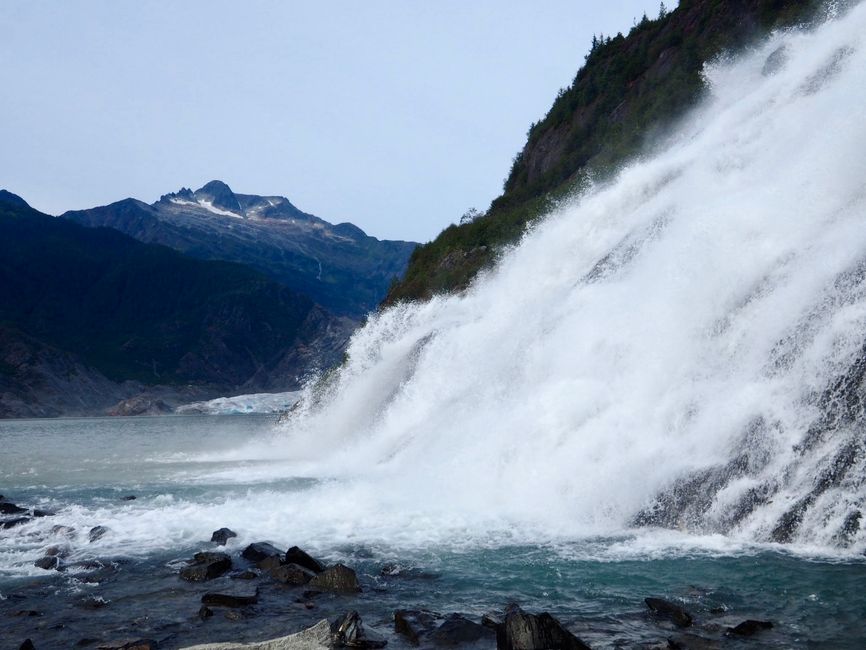 Breathtaking Trail Ride and Zipline Adventure Combo Review: An Unforgettable Alaska Ranch Experience Review 2026 - Stunning view of Nugget Falls cascading into a serene lake with mountain backdrop in Alaska.