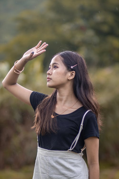 Photograph of a Girl Covering Her Face