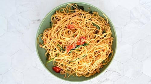 A Mouthwatering Pasta on Green Ceramic Plate