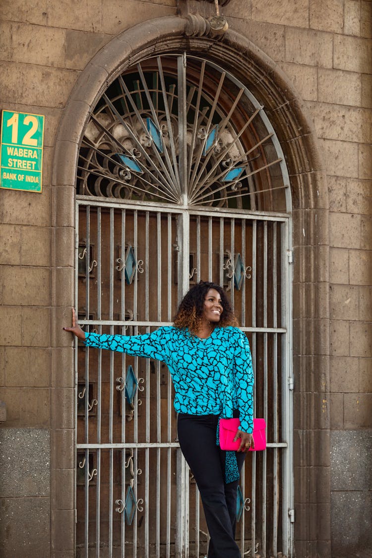 Woman Posing By Closed Door