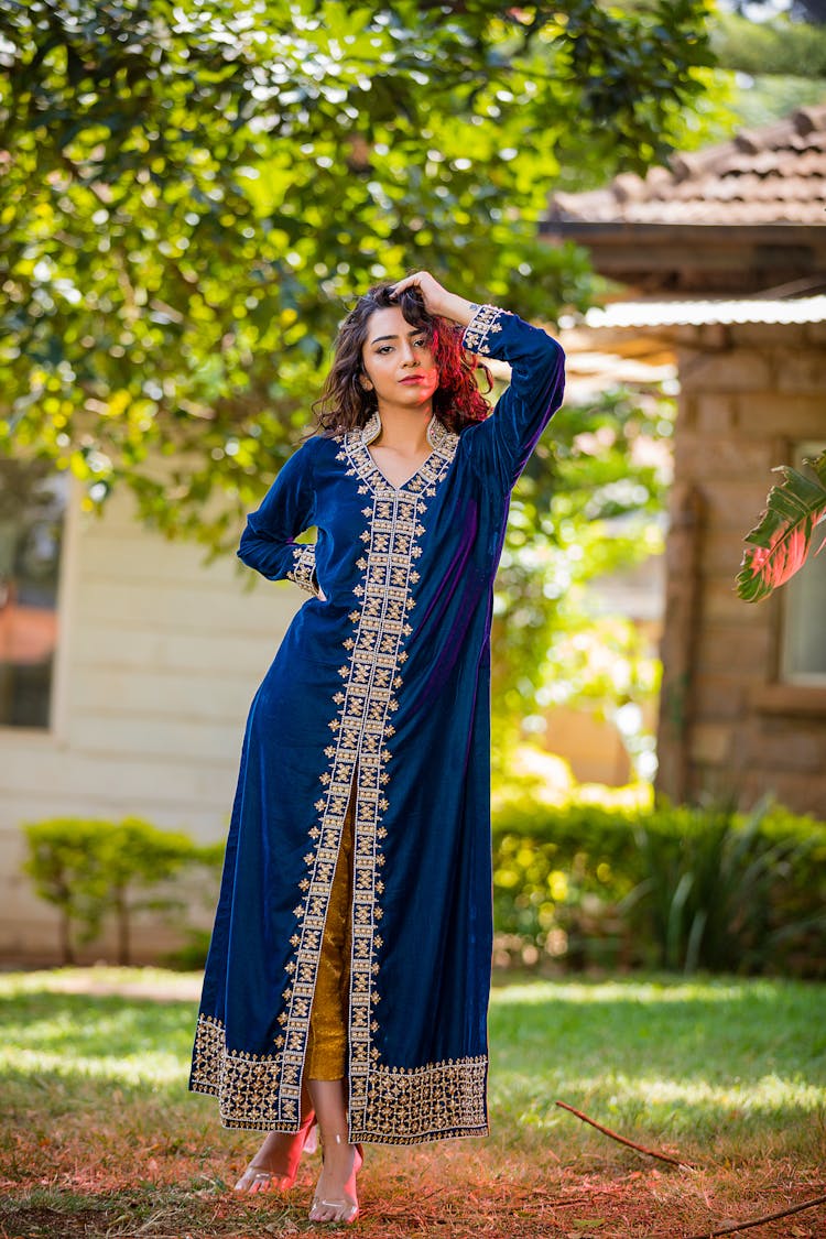 Young Woman Posing In Blue Dress