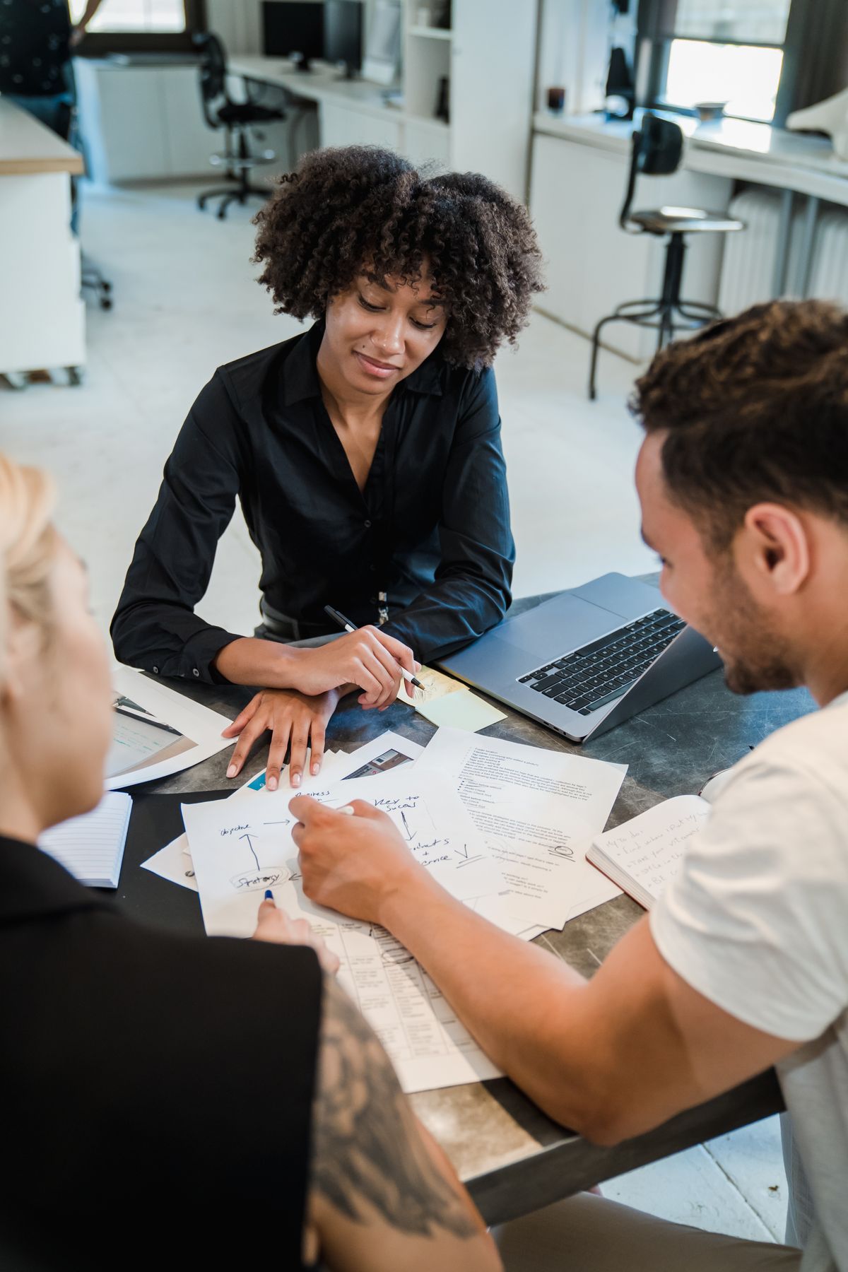 Business professionals reviewing documents together