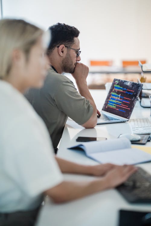 Woman and Man Working in Open Space Office