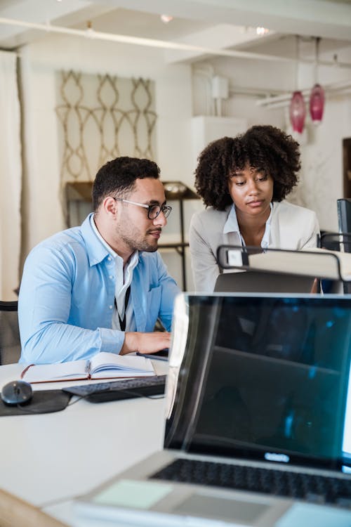 Elegant Man and Woman in Office