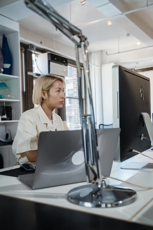 Blonde Woman Working on Computer in Office