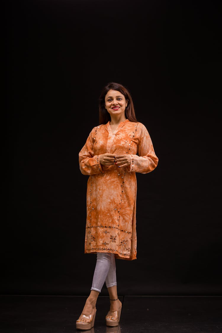 Photo Of A Smiling Woman Against Black Background 