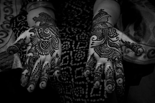 Beautiful black and white close-up of henna designs on hands, showcasing traditional Mehendi art.