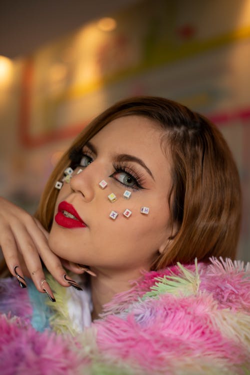 Woman With Cube Letters on Her Face 