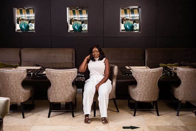 Elegant Woman Sitting In Restaurant 