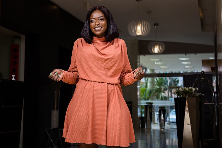 Young Woman In A Dress Smiling 