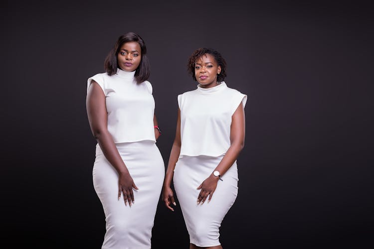 Two Women In White Dresses 