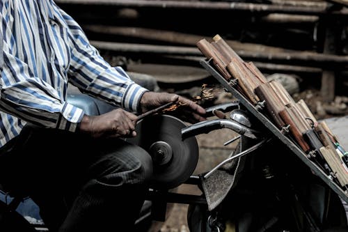 Man Sharpening a Knife