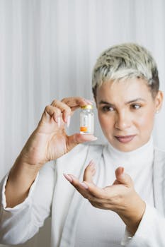 A woman examines a medicine bottle closely, emphasizing healthcare focus.