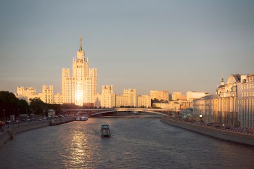 Free A breathtaking view of Moscow's skyline at sunset, showcasing iconic architecture along the river. Stock Photo