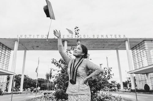 A Woman Throwing  Her Graduation Hat