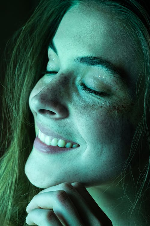 Close Up Photo of Woman Smiling
