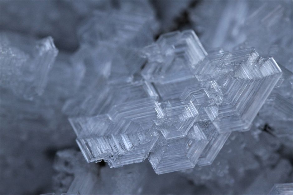 Detailed close-up of intricate ice crystal formation, showcasing natural beauty.