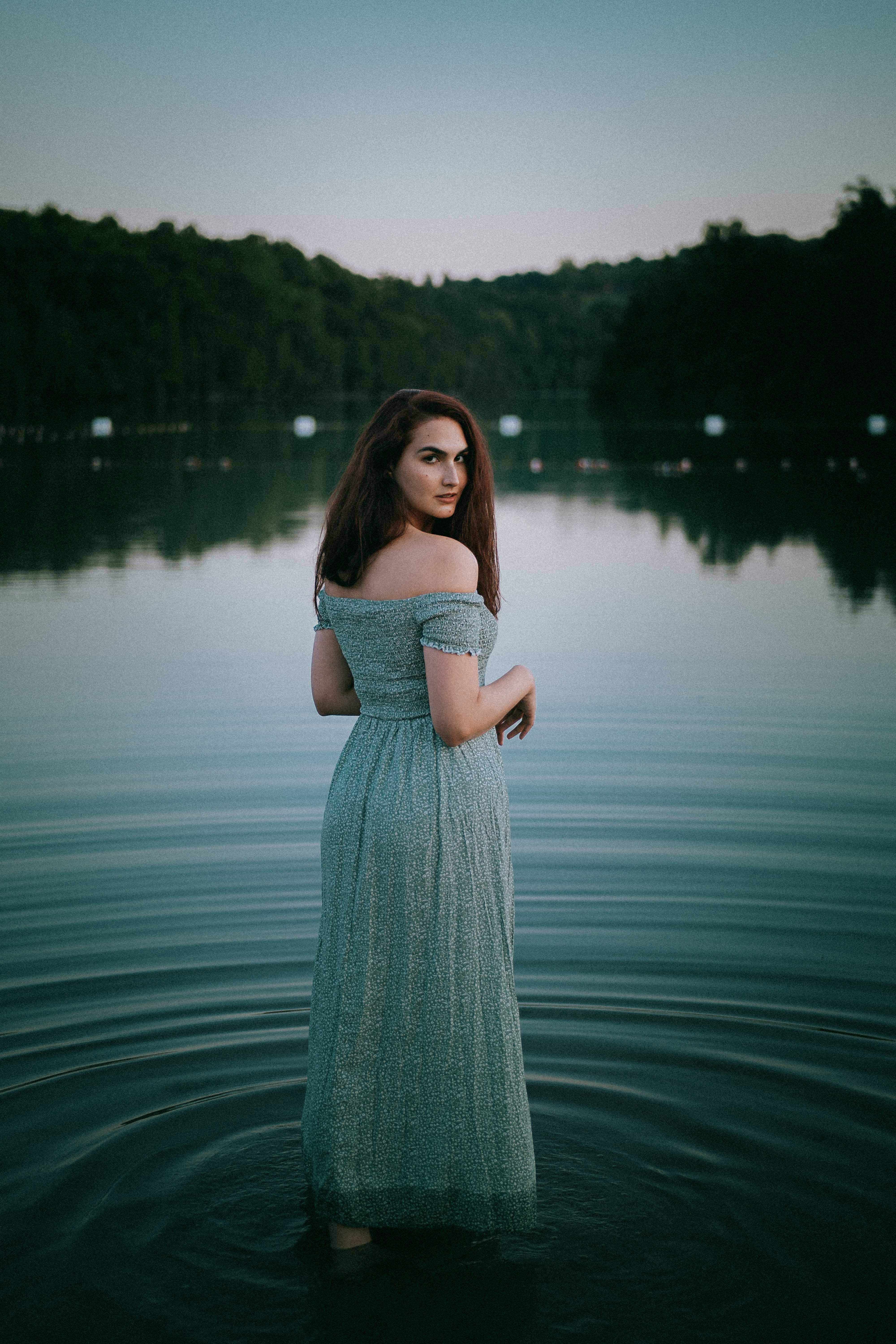 A Woman Standing in a Lake · Free Stock Photo