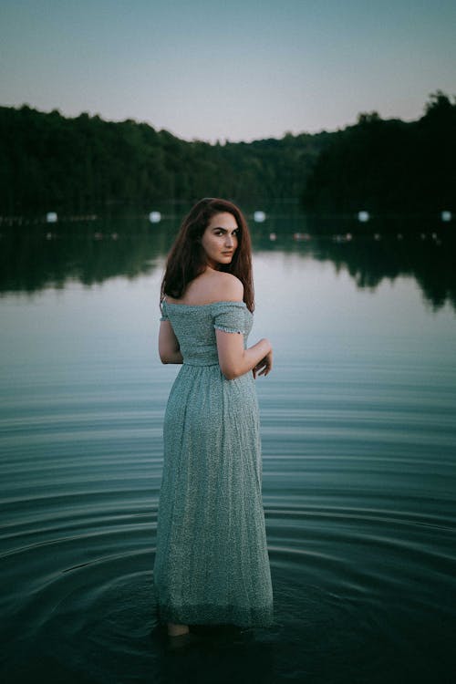 A Woman Standing in a Lake