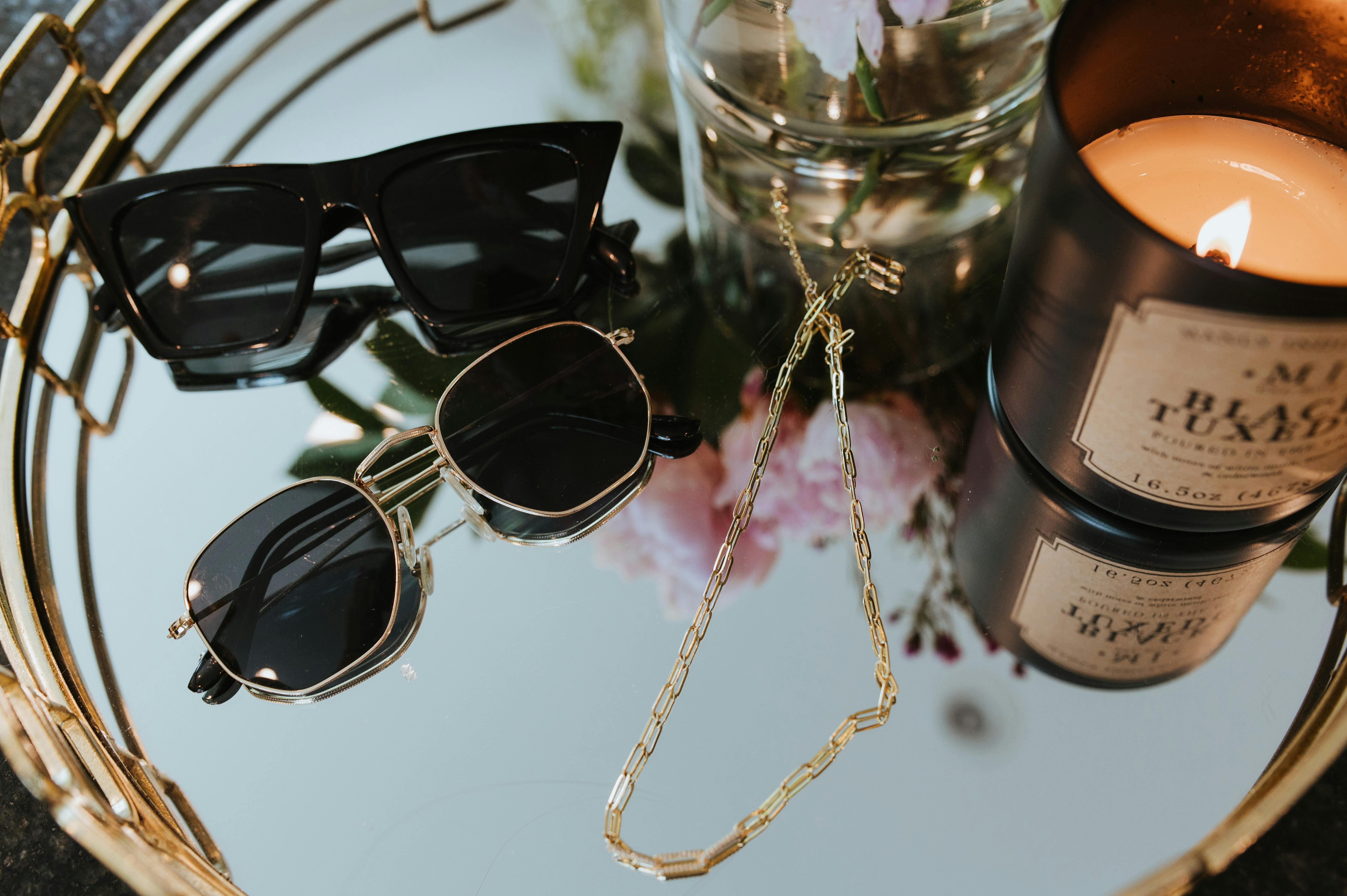 display of sunglasses and necklace