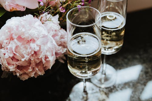Wine Glasses Beside Flowers