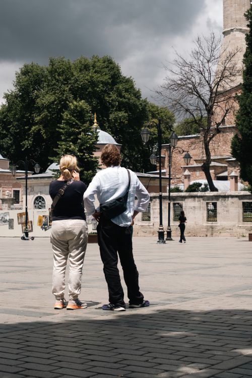 Free Tourists enjoy a sunny day exploring the landmarks of Istanbul, capturing the city's rich history and vibrant atmosphere. Stock Photo