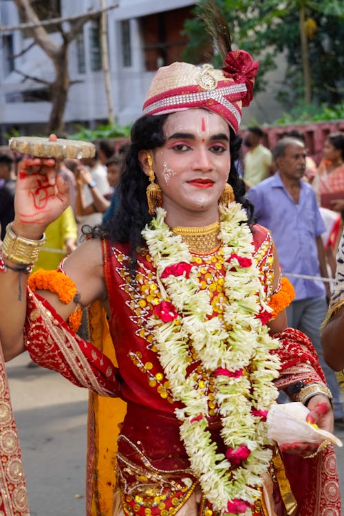 A Woman Wearing Saree with Hat During a Festival
