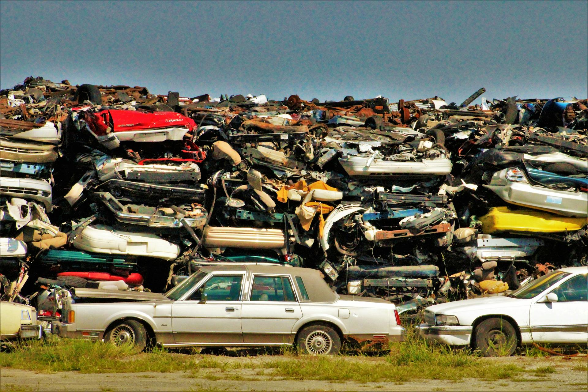 Dumped Cars on the Grass Field