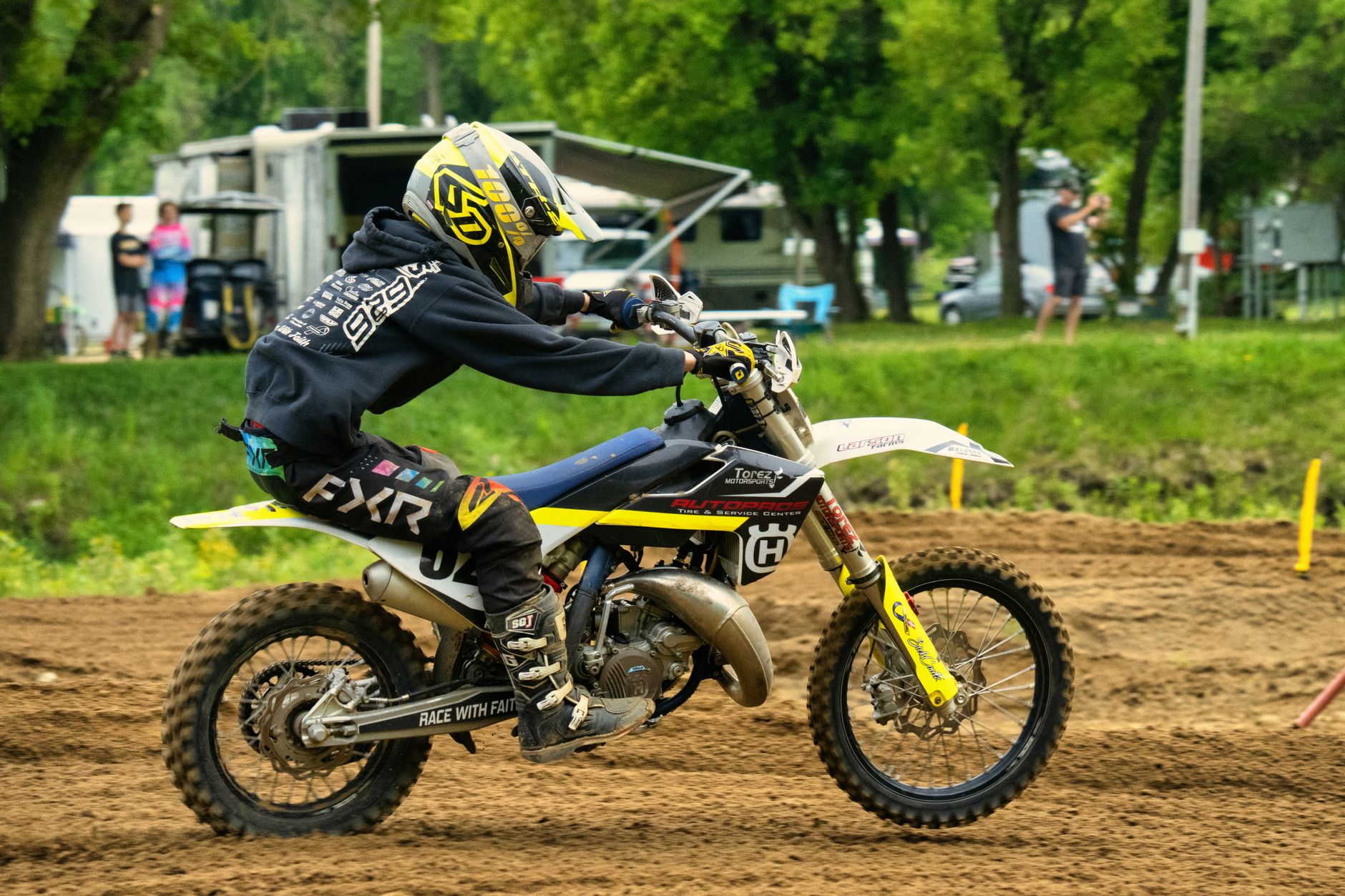 Close-up of a motocross racer speeding on a dirt track in Millville, MN.